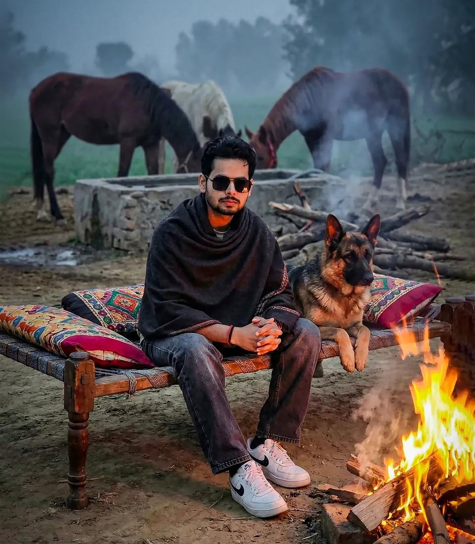Rustic Charpai Bonfire: Man, Dog, Dawn