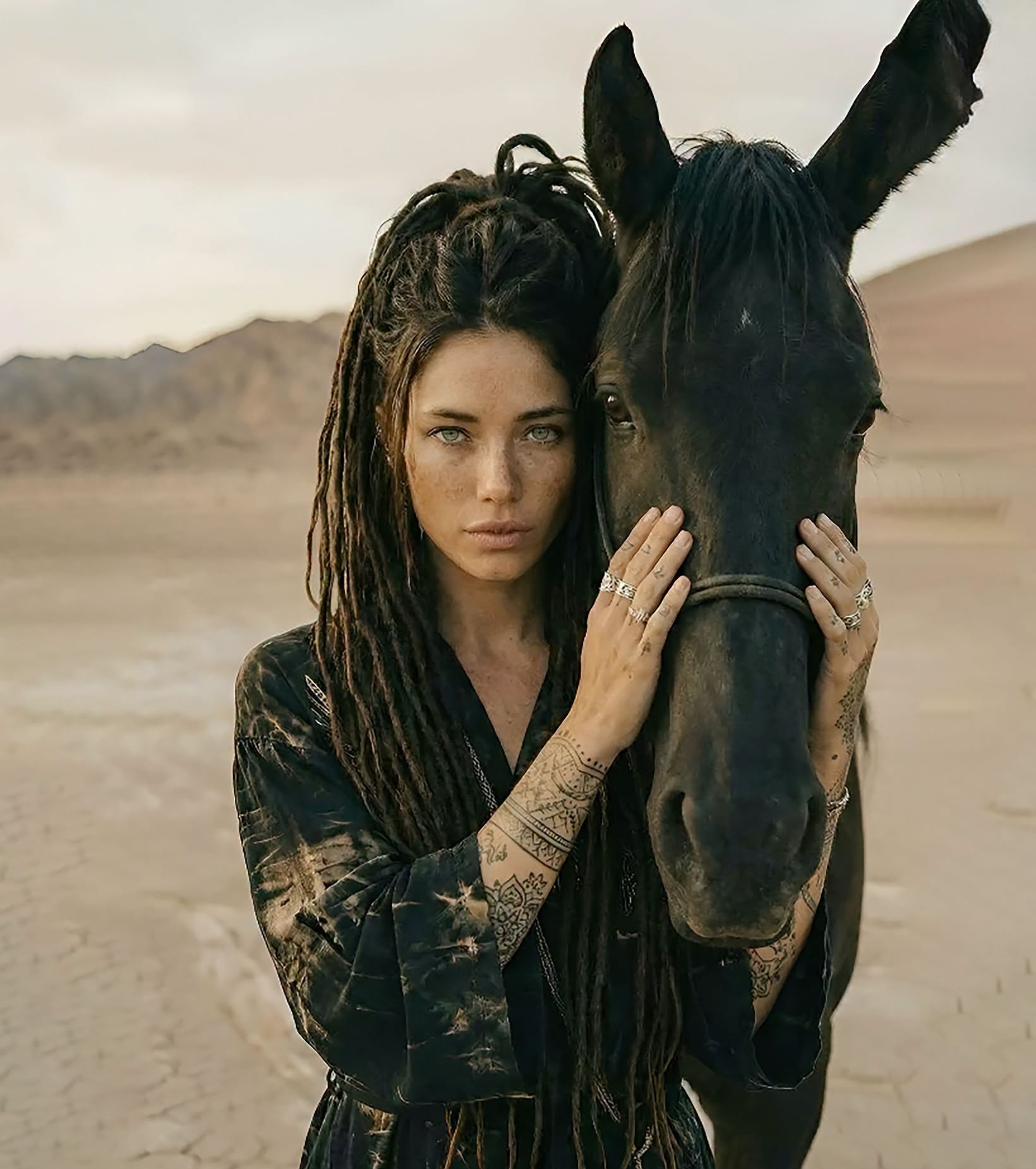 Desert's Embrace: Woman and Black Horse