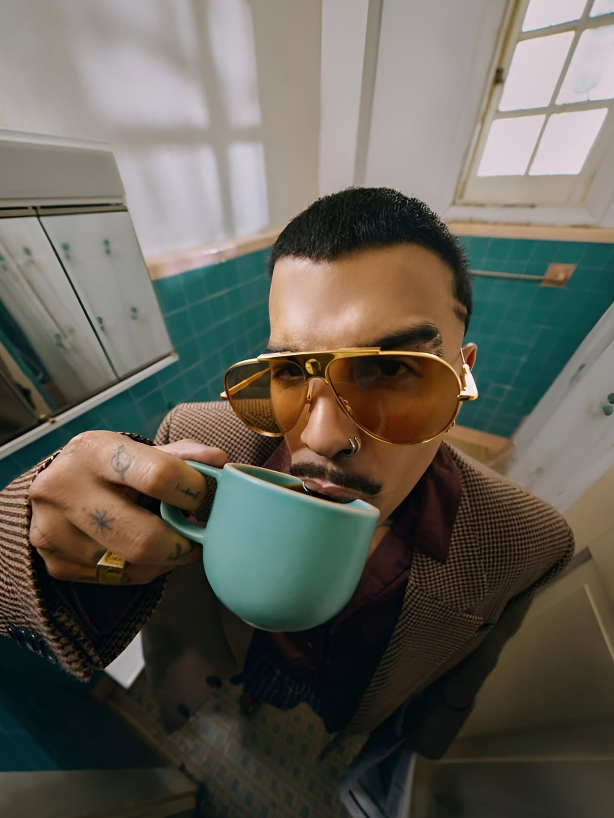 Fisheye Fashion: Stylish Man in Teal Bathroom