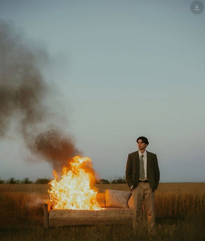Surreal Solitude: Man, Fire, Empty Field